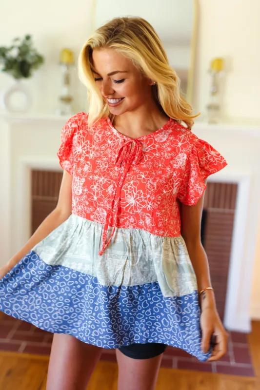 Red & Blue Color Block Tiered Tie Neck Top sold by Charming Charlie