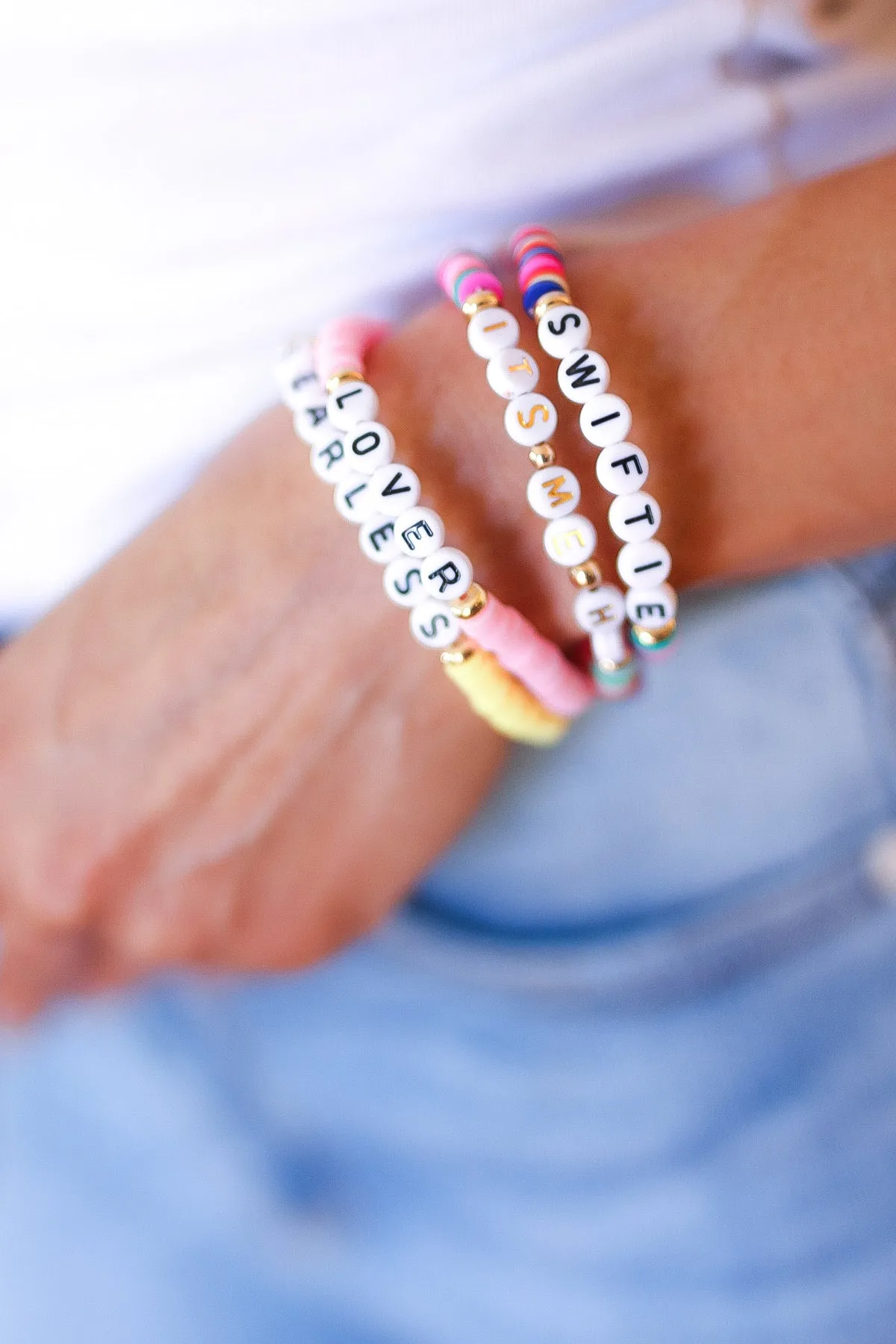 Yellow "Fearless" & Pink "Lover" Swiftie Friendship Bracelet sold by Charming Charlie