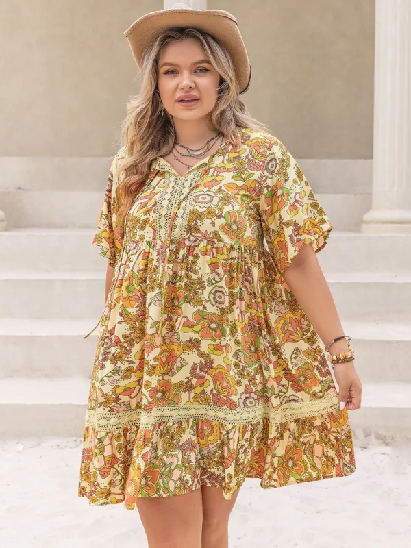 Plus Size Printed Tie Neck Short Sleeve Mini Dress sold by Charming Charlie