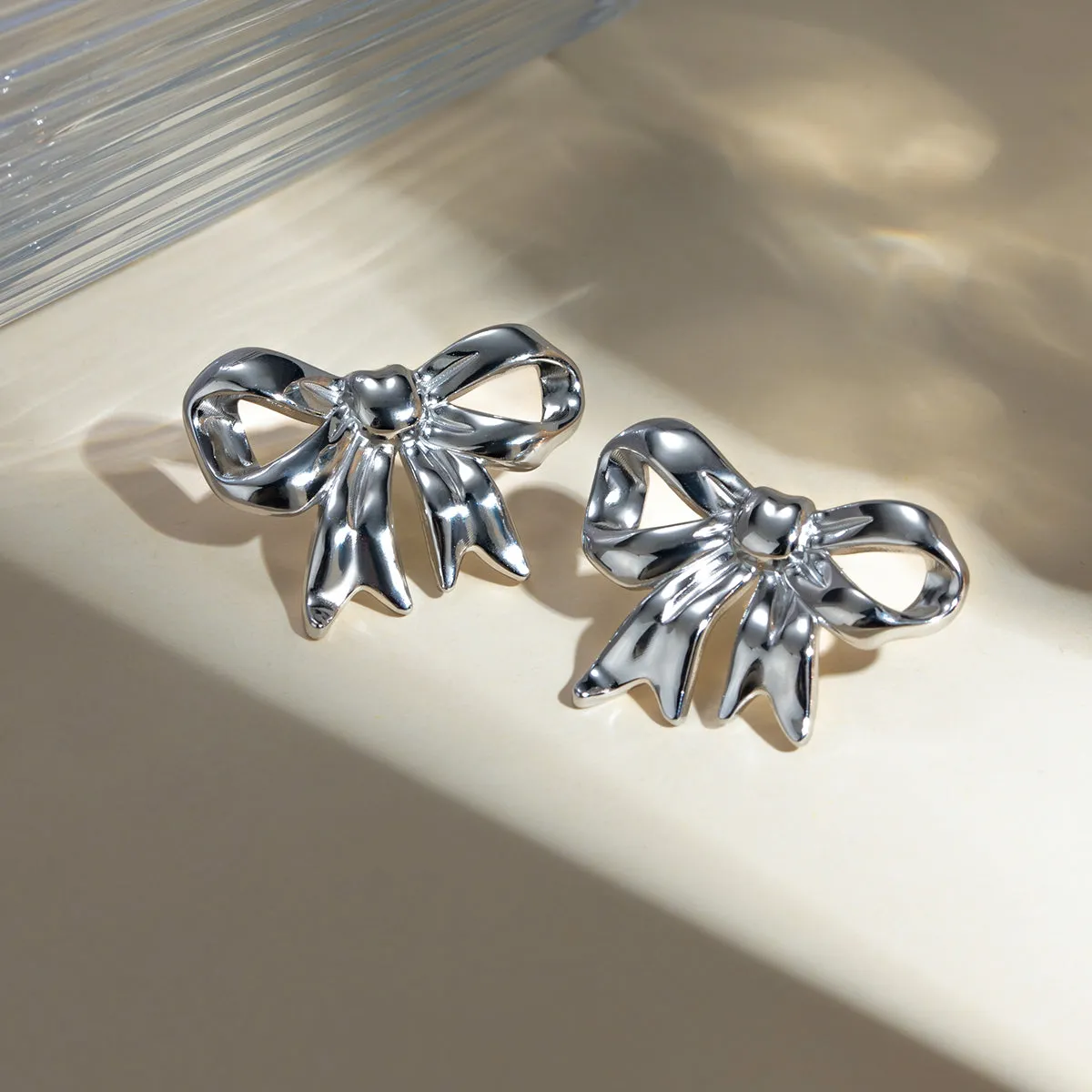 Stainless Steel Bow Stud Earrings sold by Charming Charlie product image thumbnail 3
