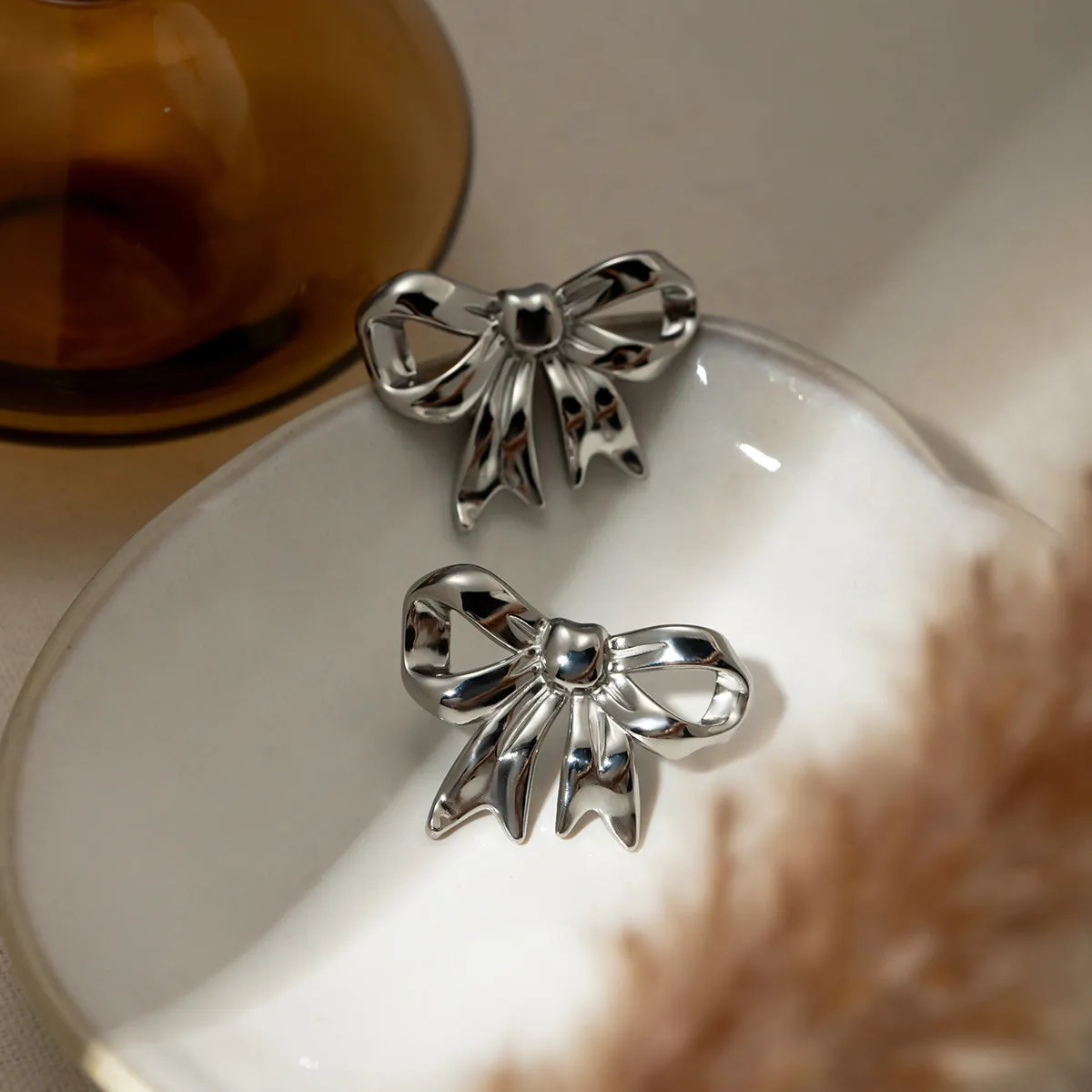 Stainless Steel Bow Stud Earrings sold by Charming Charlie product image thumbnail 4