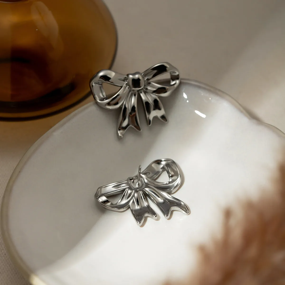 Stainless Steel Bow Stud Earrings sold by Charming Charlie product image thumbnail 5