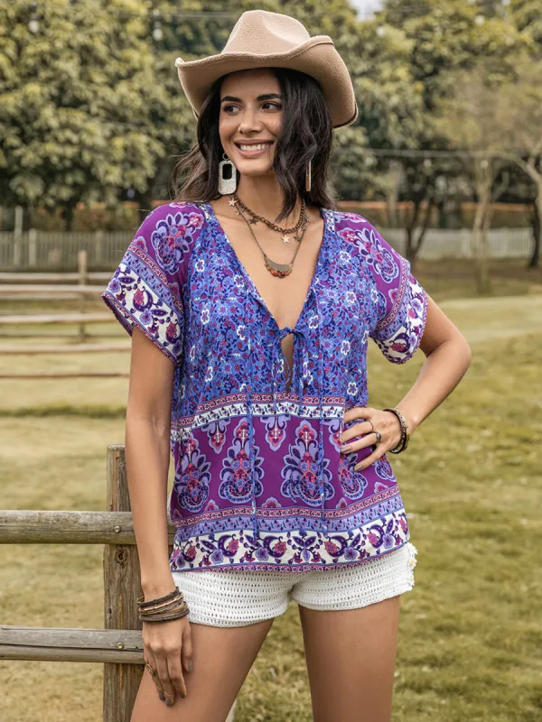 Printed Tie Neck Short Sleeve Blouse sold by Charming Charlie
