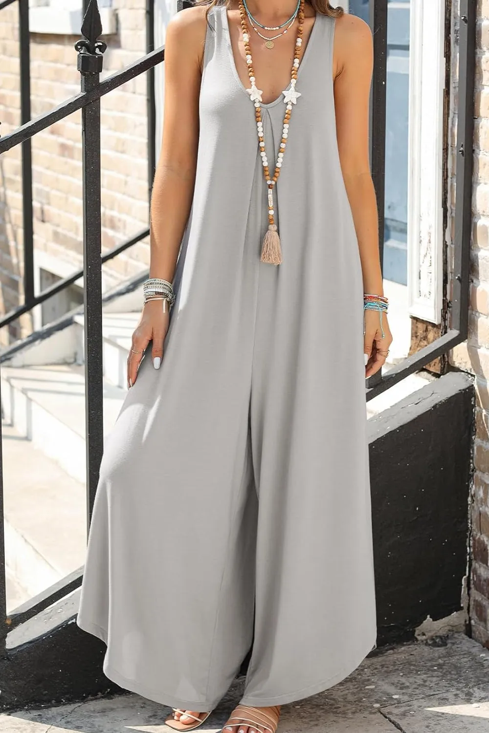 Pocketed Scoop Neck Wide Leg Jumpsuit sold by Charming Charlie