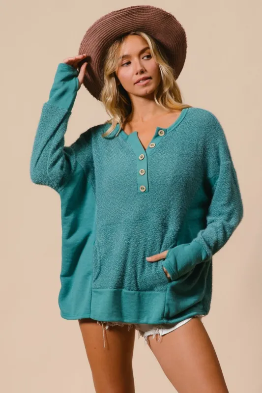 BiBi Thumb Opening Long Sleeve Top with Kangaroo Pocket sold by Charming Charlie