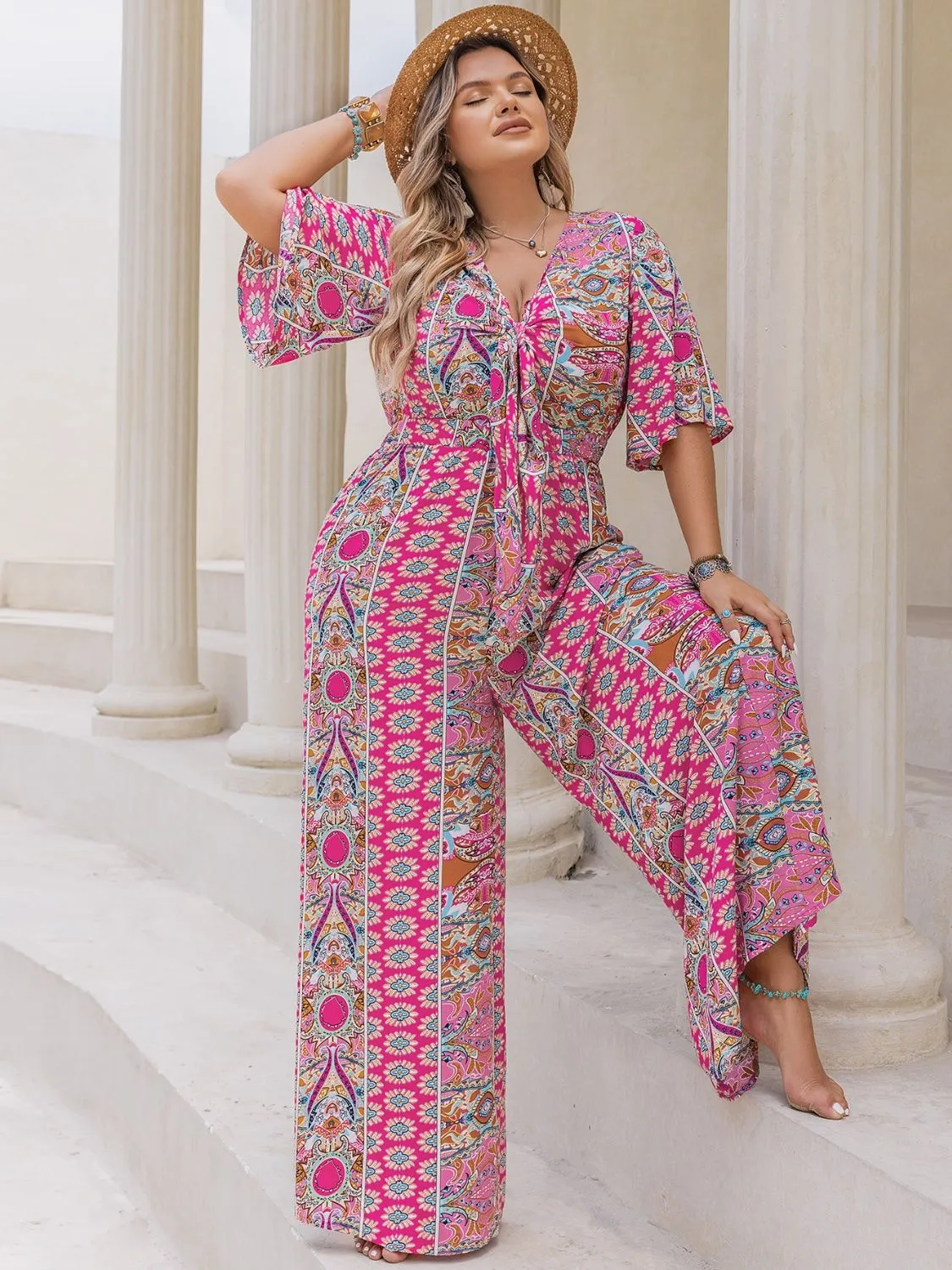 Plus Size Printed Half Sleeve Wide Leg Jumpsuit sold by Charming Charlie product image thumbnail 5