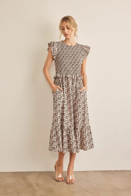 In February Floral Smocked Ruffled Midi Dress sold by Charming Charlie