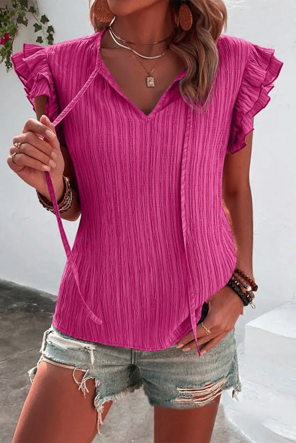 Ruffled Tie Neck Cap Sleeve Blouse sold by Charming Charlie