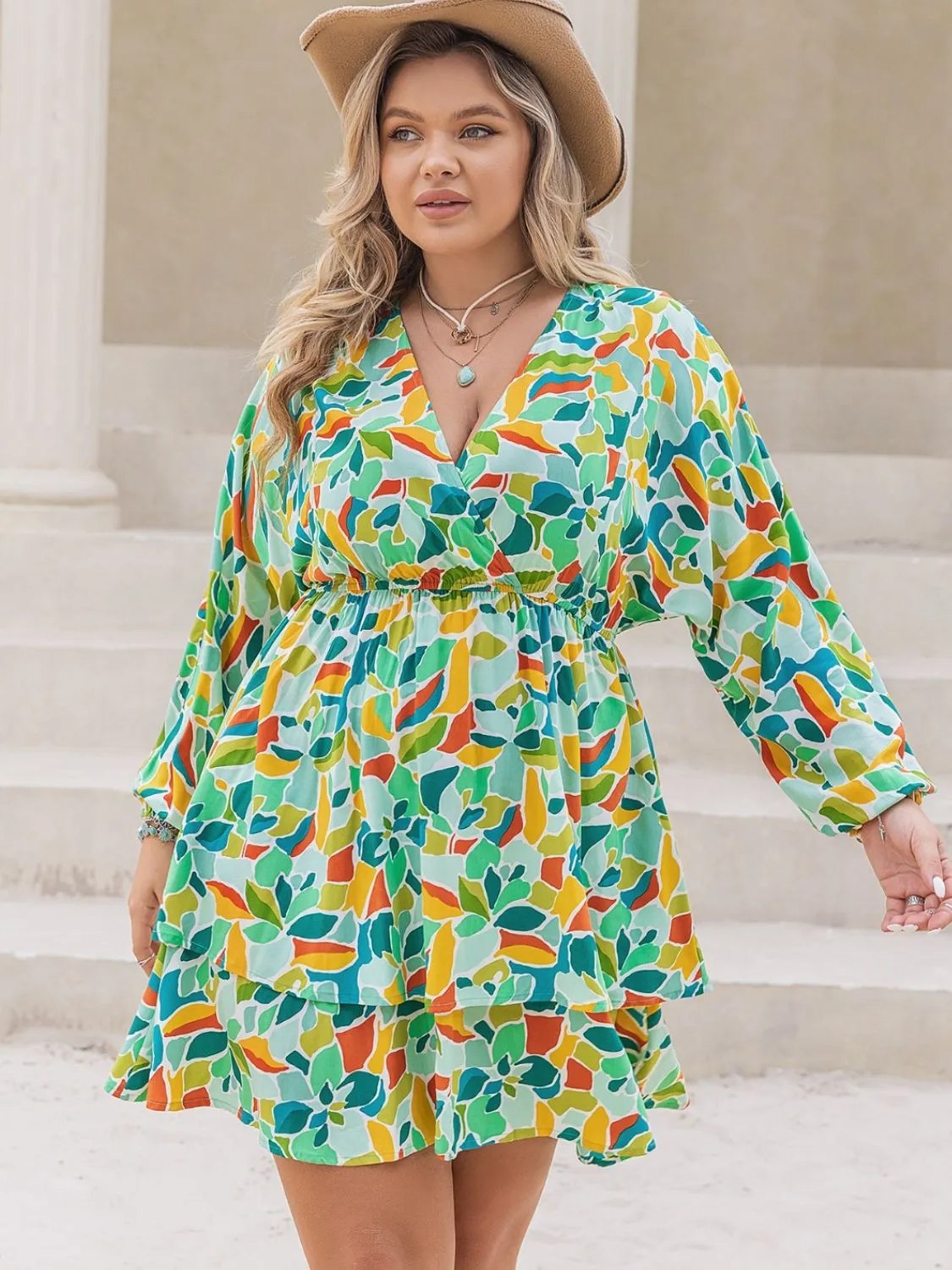 Plus Size Printed Surplice Long Sleeve Mini Dress sold by Charming Charlie
