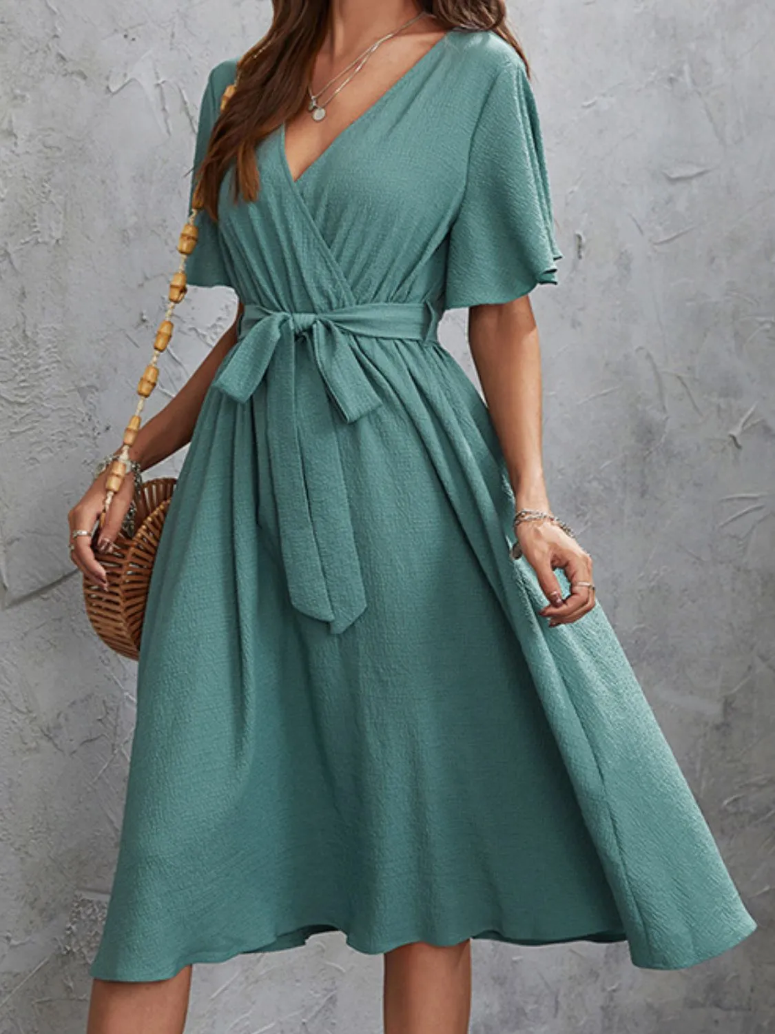 Surplice Flutter Sleeve Midi Dress sold by Charming Charlie product image thumbnail 4