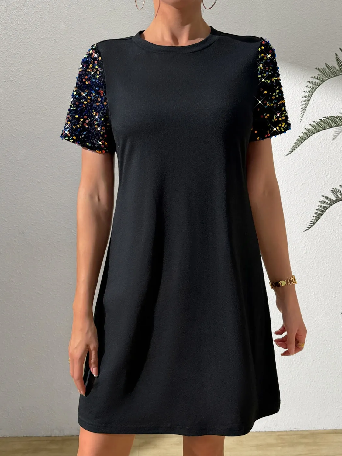 Sequin Round Neck Short Sleeve Mini Dress sold by Charming Charlie