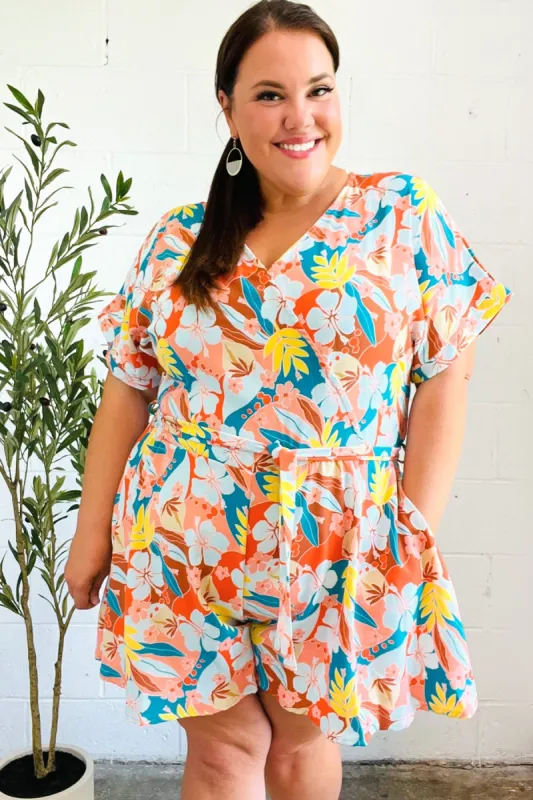 Tropical Trance Coral Tropical Floral Surplice Woven Romper sold by Charming Charlie