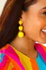 Yellow Raffia Lantern Pom Dangle Earrings sold by Charming Charlie