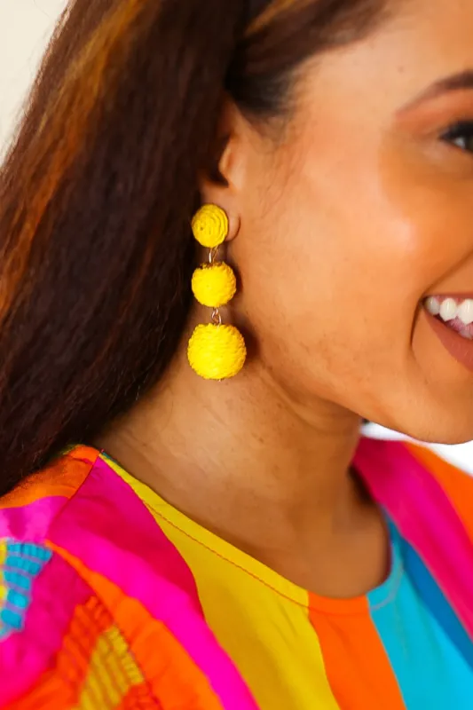 Yellow Raffia Lantern Pom Dangle Earrings sold by Charming Charlie