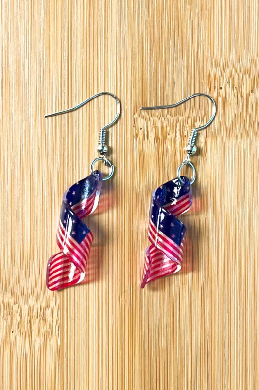 American Flag Acrylic Ribbon Twirl Dangle Earrings sold by Charming Charlie
