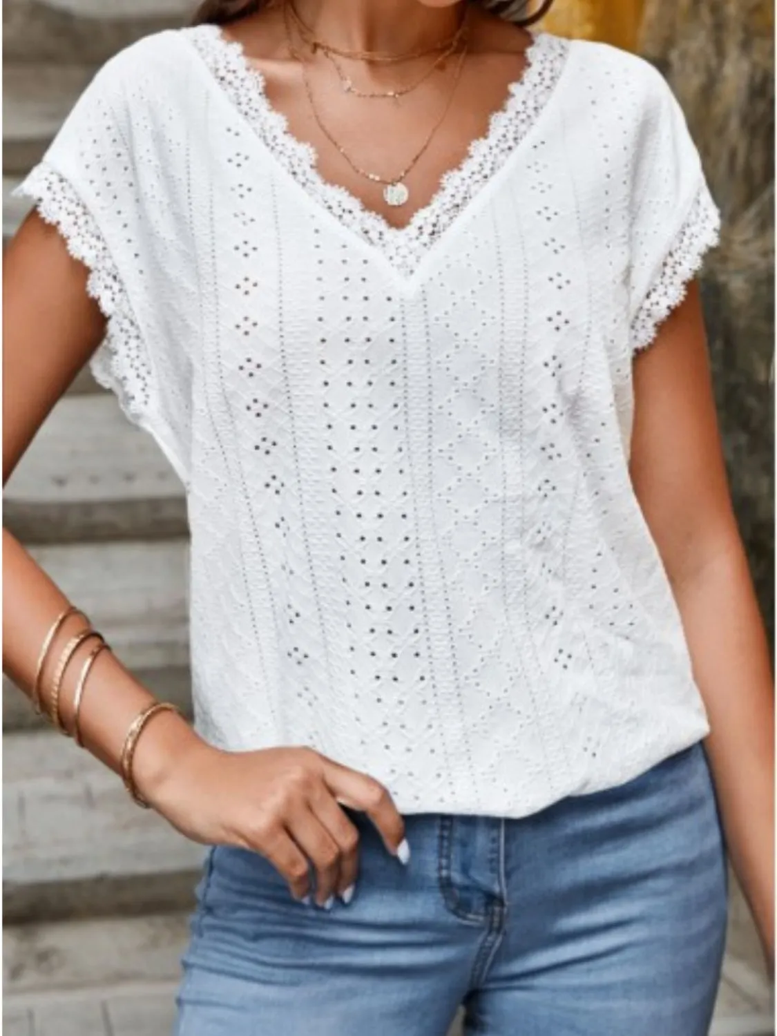 Eyelet V-Neck Cap Sleeve Blouse sold by Charming Charlie