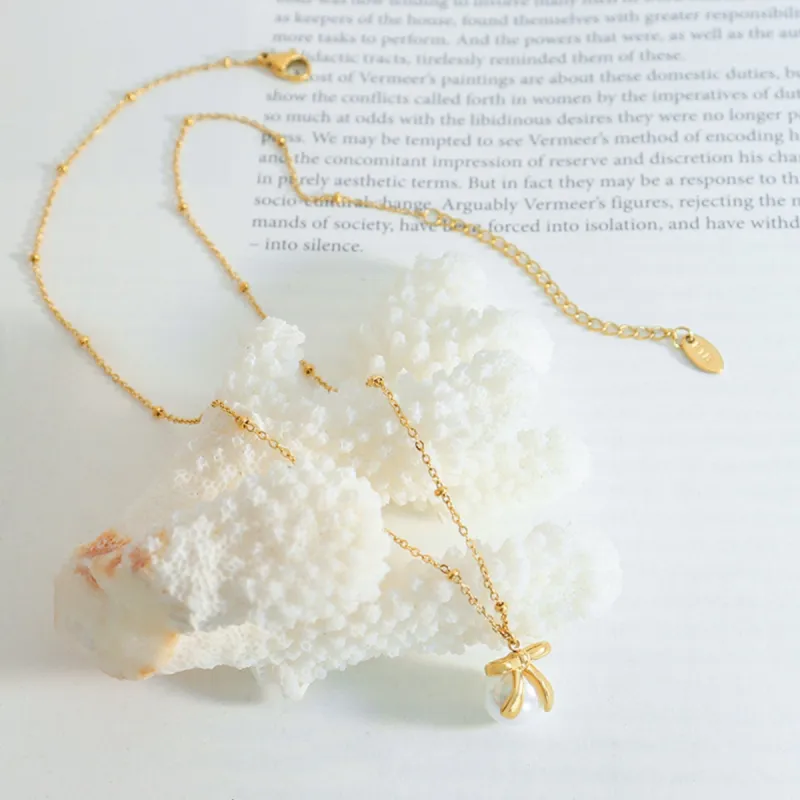 Titanium Steel Bow & Bead Pendant Necklace sold by Charming Charlie