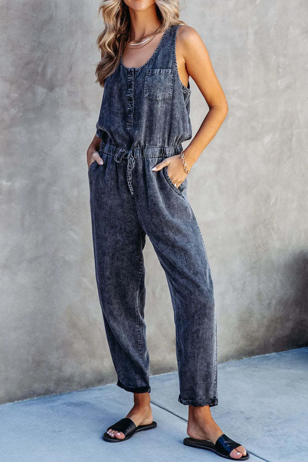 Pocketed Half Button Sleeveless Denim Jumpsuit sold by Charming Charlie