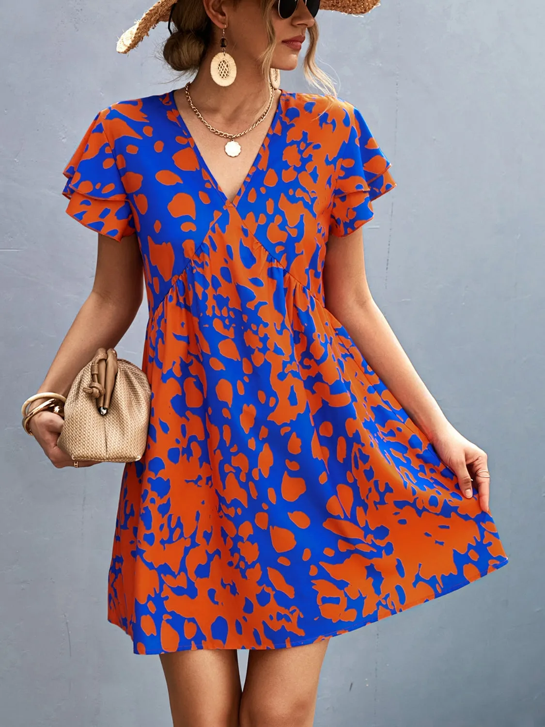 Ruffled Printed V-Neck Short Sleeve Mini Dress sold by Charming Charlie