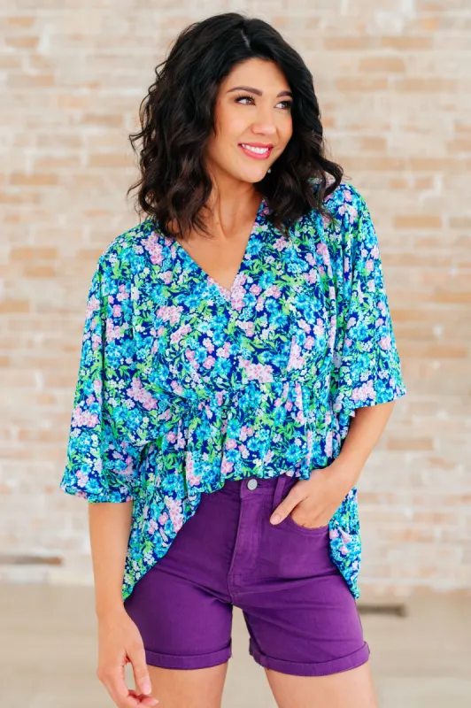 Dreamer Peplum Top in Navy and Mint Floral sold by Charming Charlie