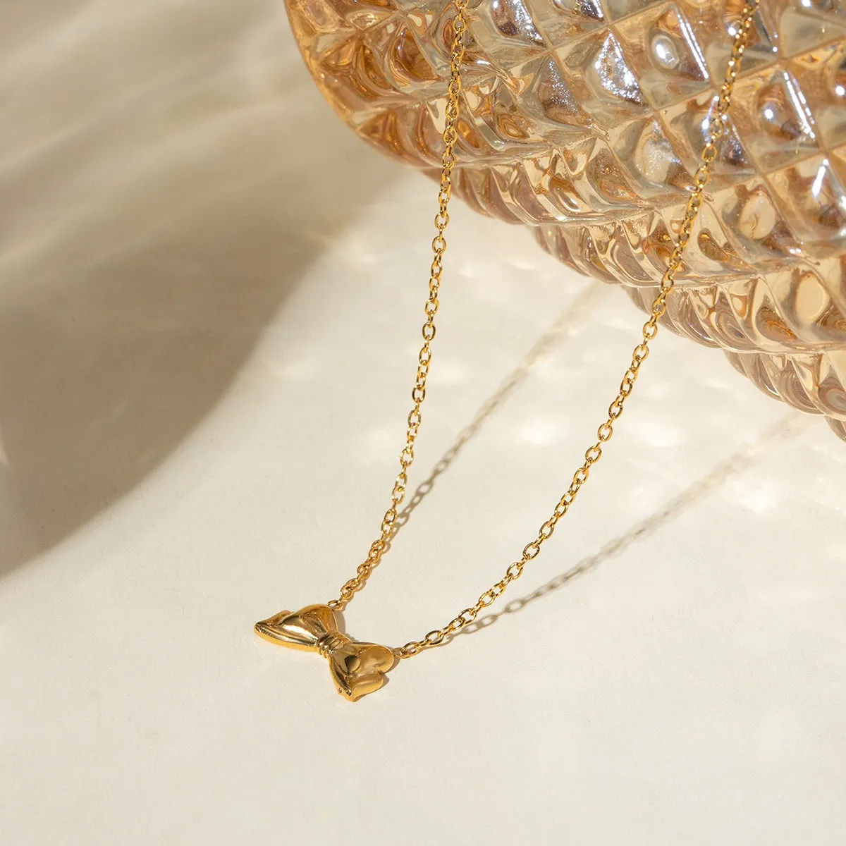 18K Gold-Plated Stainless Steel Bow Necklace sold by Charming Charlie product image thumbnail 2