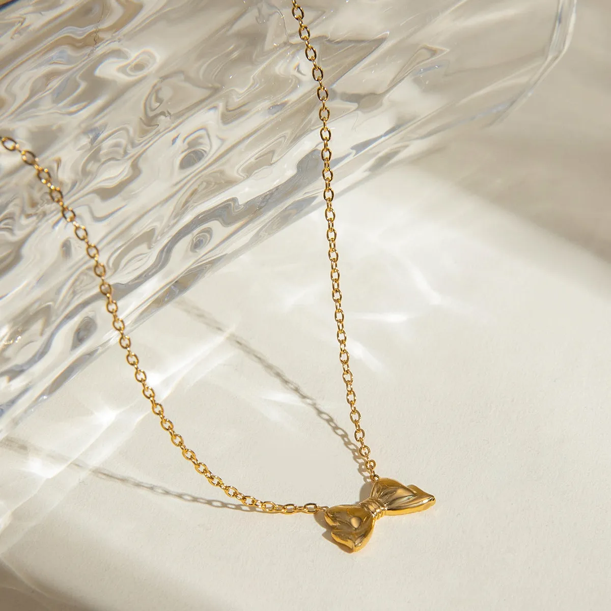 18K Gold-Plated Stainless Steel Bow Necklace sold by Charming Charlie product image thumbnail 3
