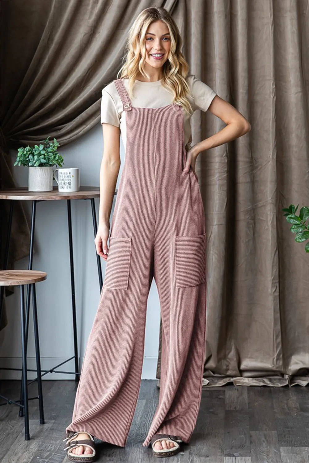 Heimish Full Size Ribbed Front Pocket Sleeveless Jumpsuit sold by Charming Charlie