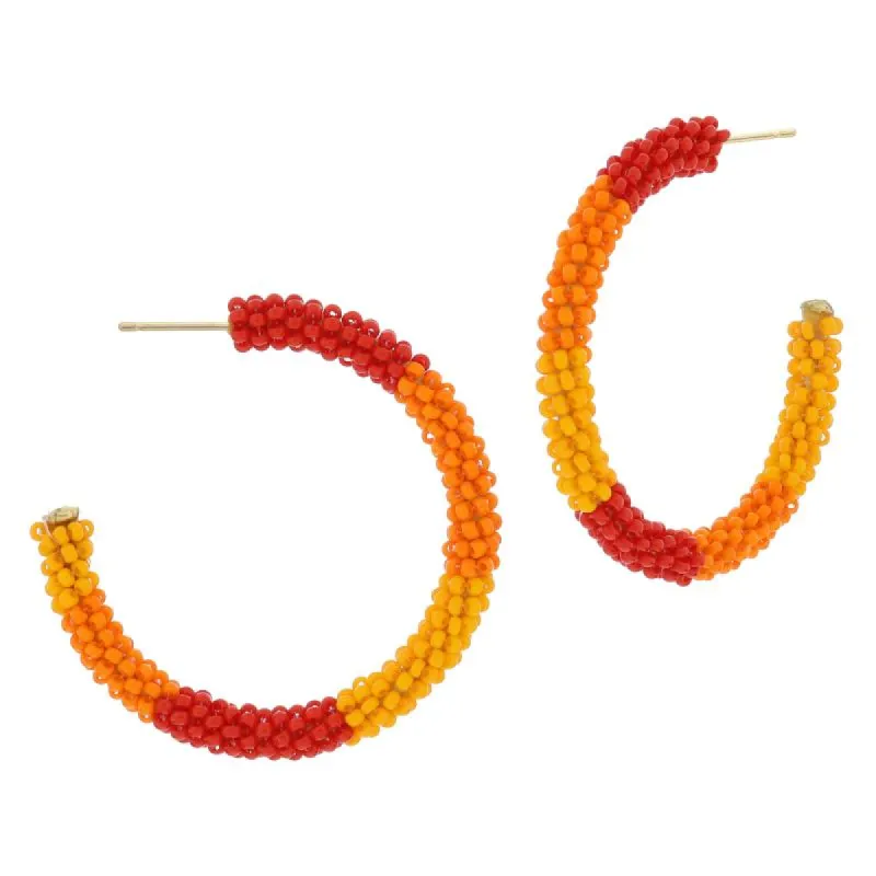Mullti Orange Colorblock Beaded Hoop Earrings, 2" Top to Bottom sold by Charming Charlie