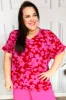 Tropical Trance Magenta Floral V Neck Woven Top sold by Charming Charlie