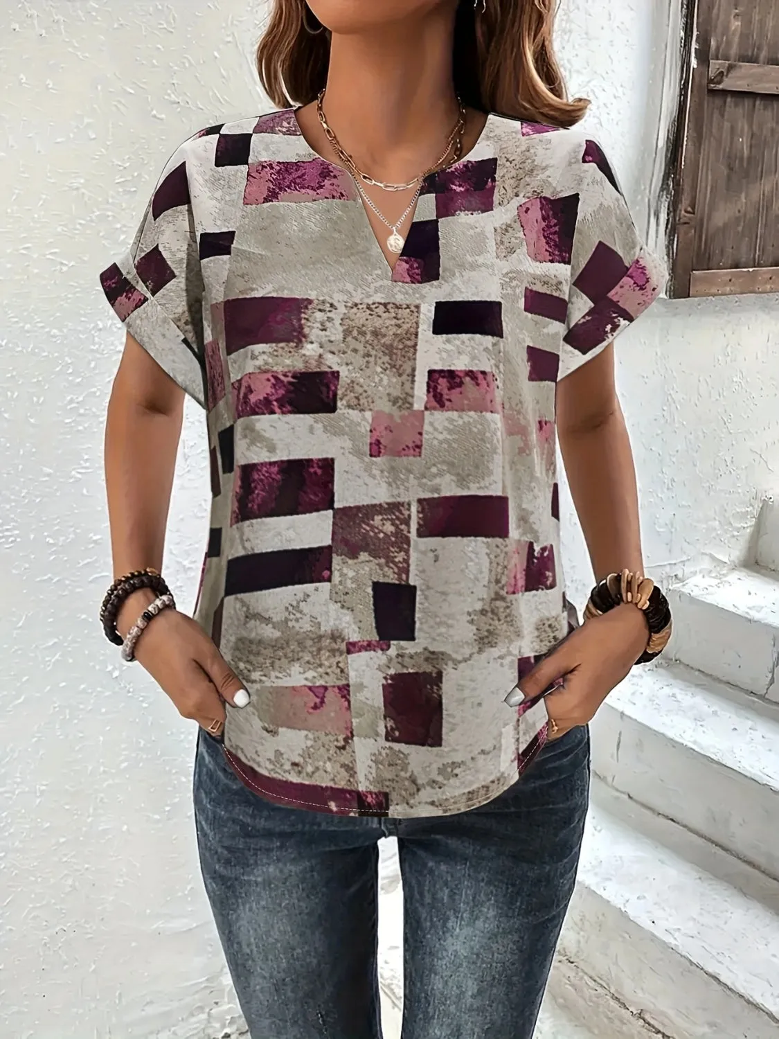 Printed Notched Short Sleeve Blouse sold by Charming Charlie