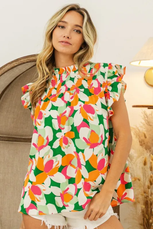 BiBi Floral Smocked Ruffled Blouse sold by Charming Charlie