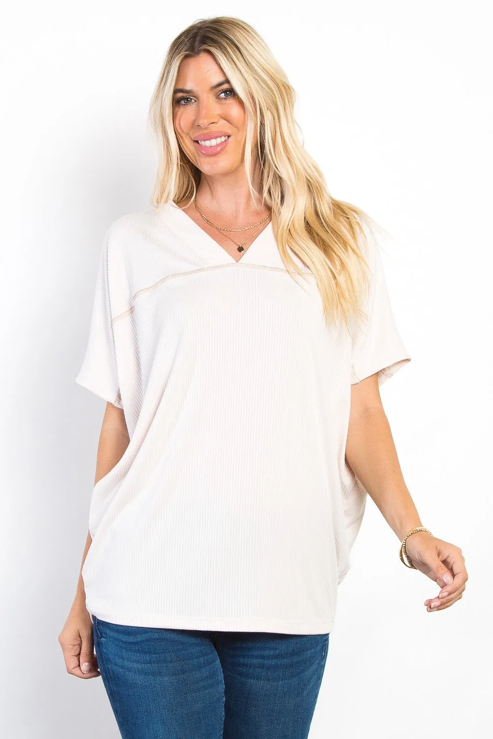 Be Stage Full Size V-Neck Short Sleeve Ribbed Top sold by Charming Charlie