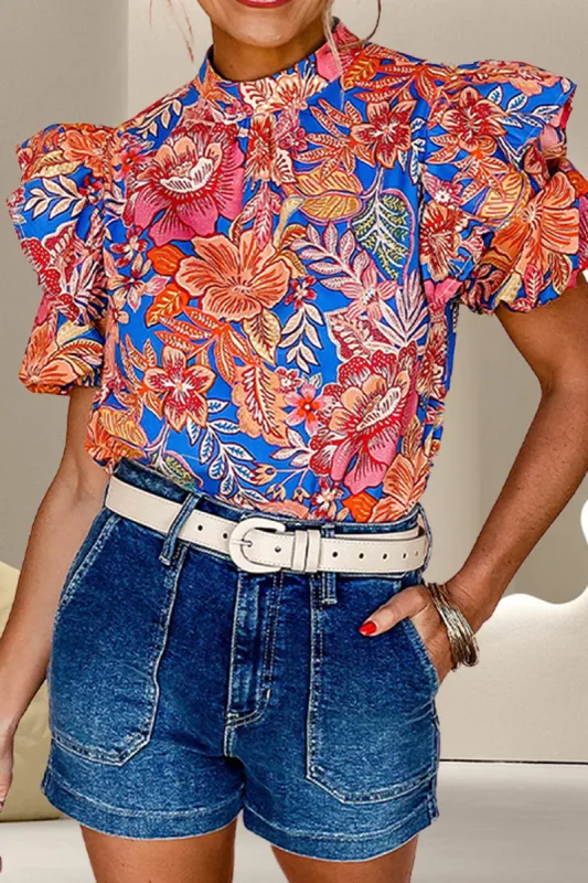 Ruffled Printed Mock Neck Short Sleeve Blouse sold by Charming Charlie