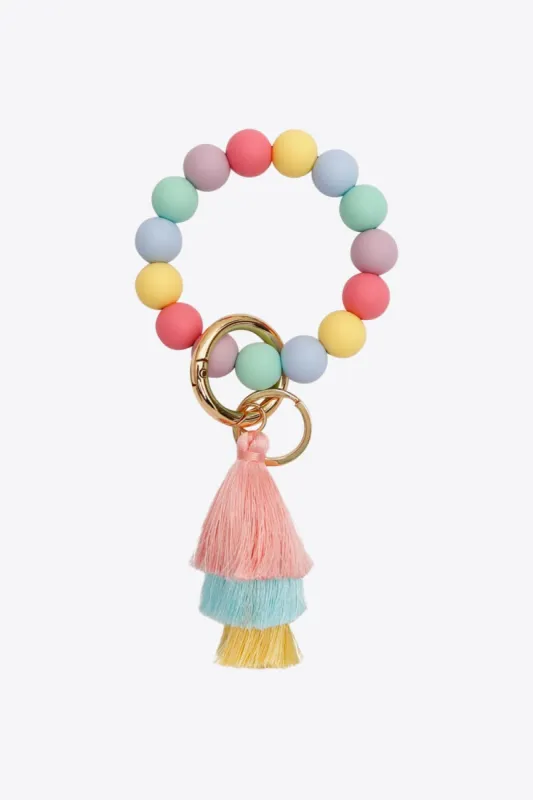 Silica Gel Bead Wristlet Keychain with Layered Tassels sold by Charming Charlie
