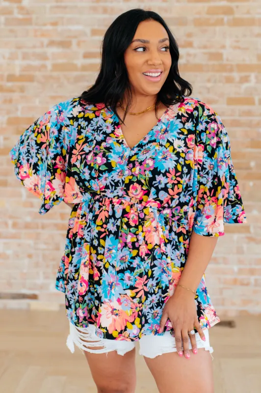 Dreamer Peplum Top in Black Multi Floral sold by Charming Charlie
