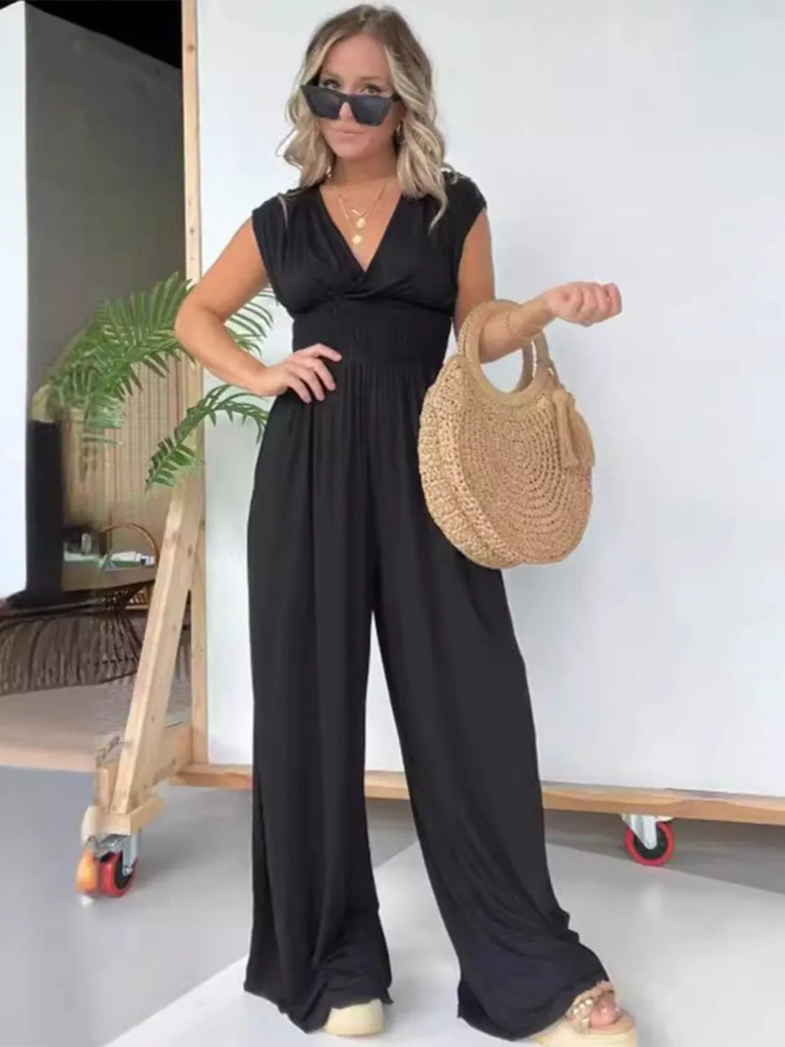 Smocked Cap Sleeve Wide Leg Jumpsuit sold by Charming Charlie