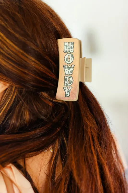 Brown Cow Print "HOWDY" Hair Claw sold by Charming Charlie
