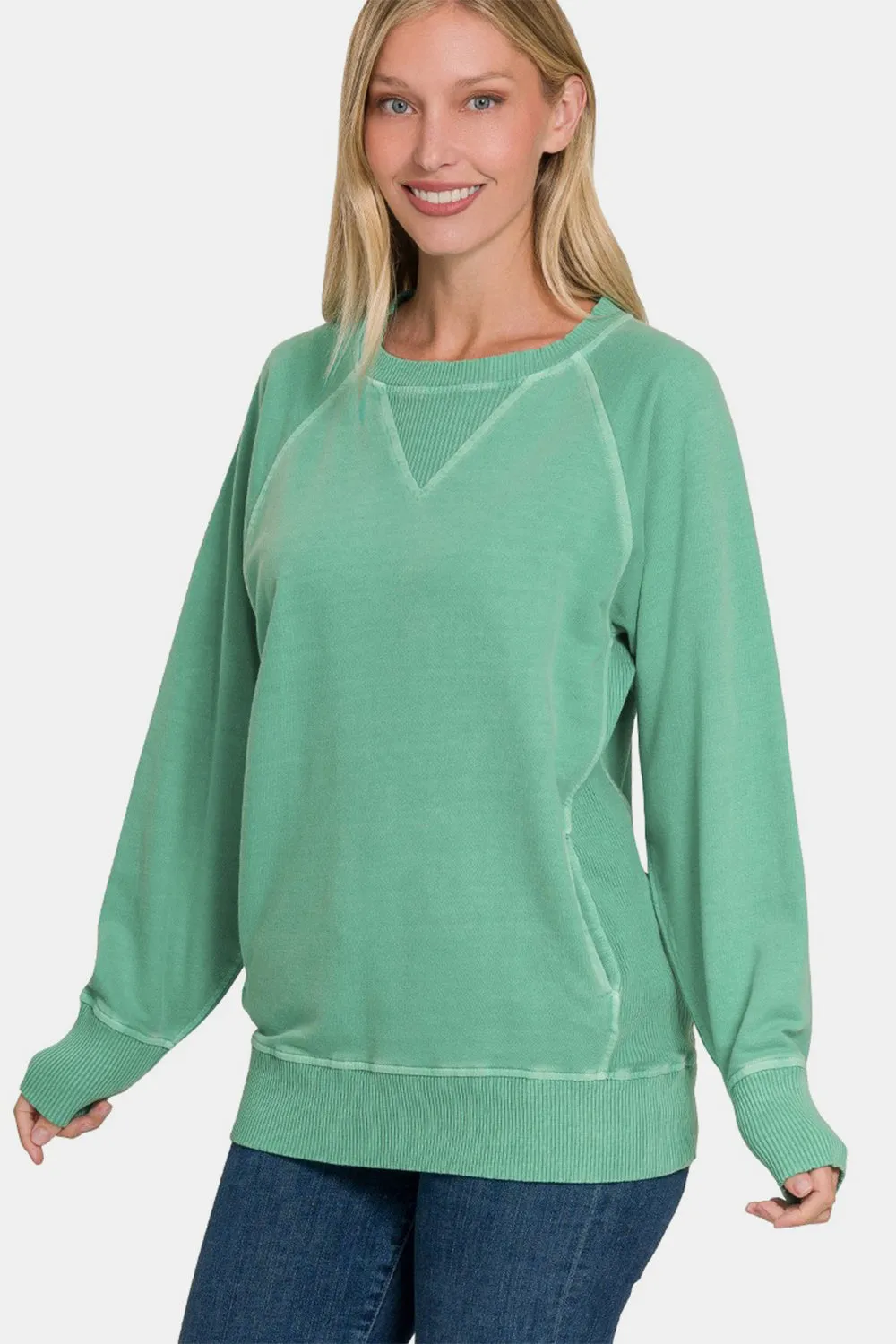 Zenana Pocketed Round Neck Long Sleeve Sweatshirt sold by Charming Charlie