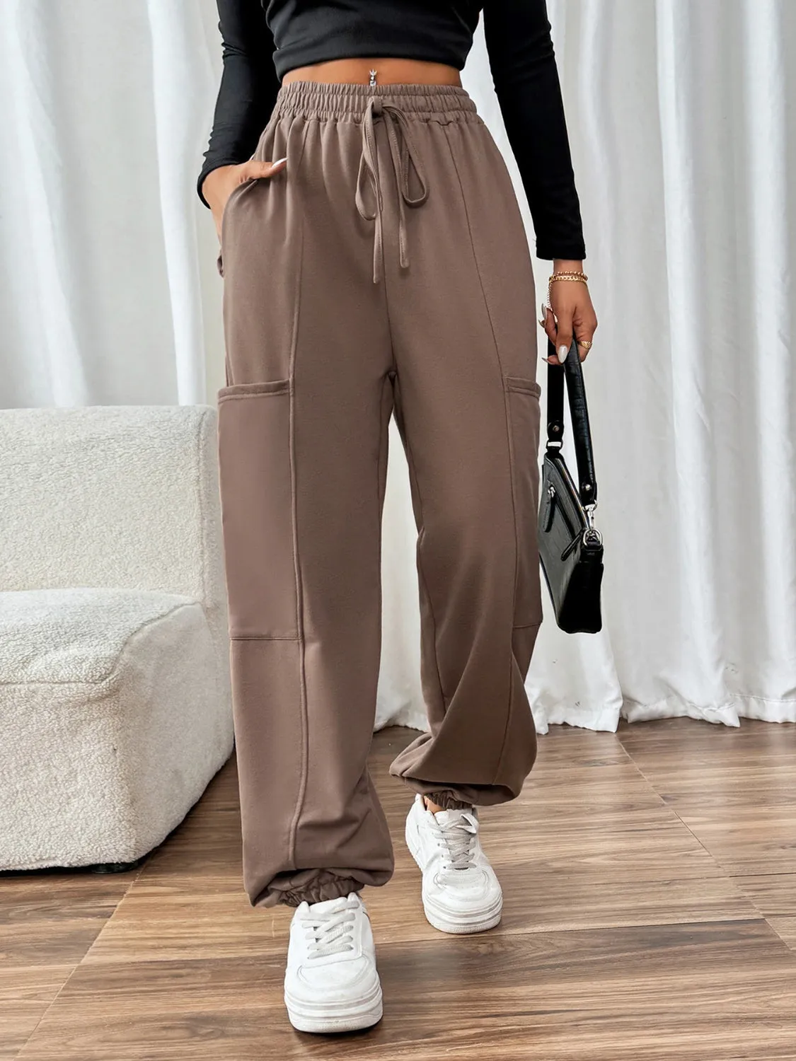 Tied Joggers with Pockets sold by Charming Charlie