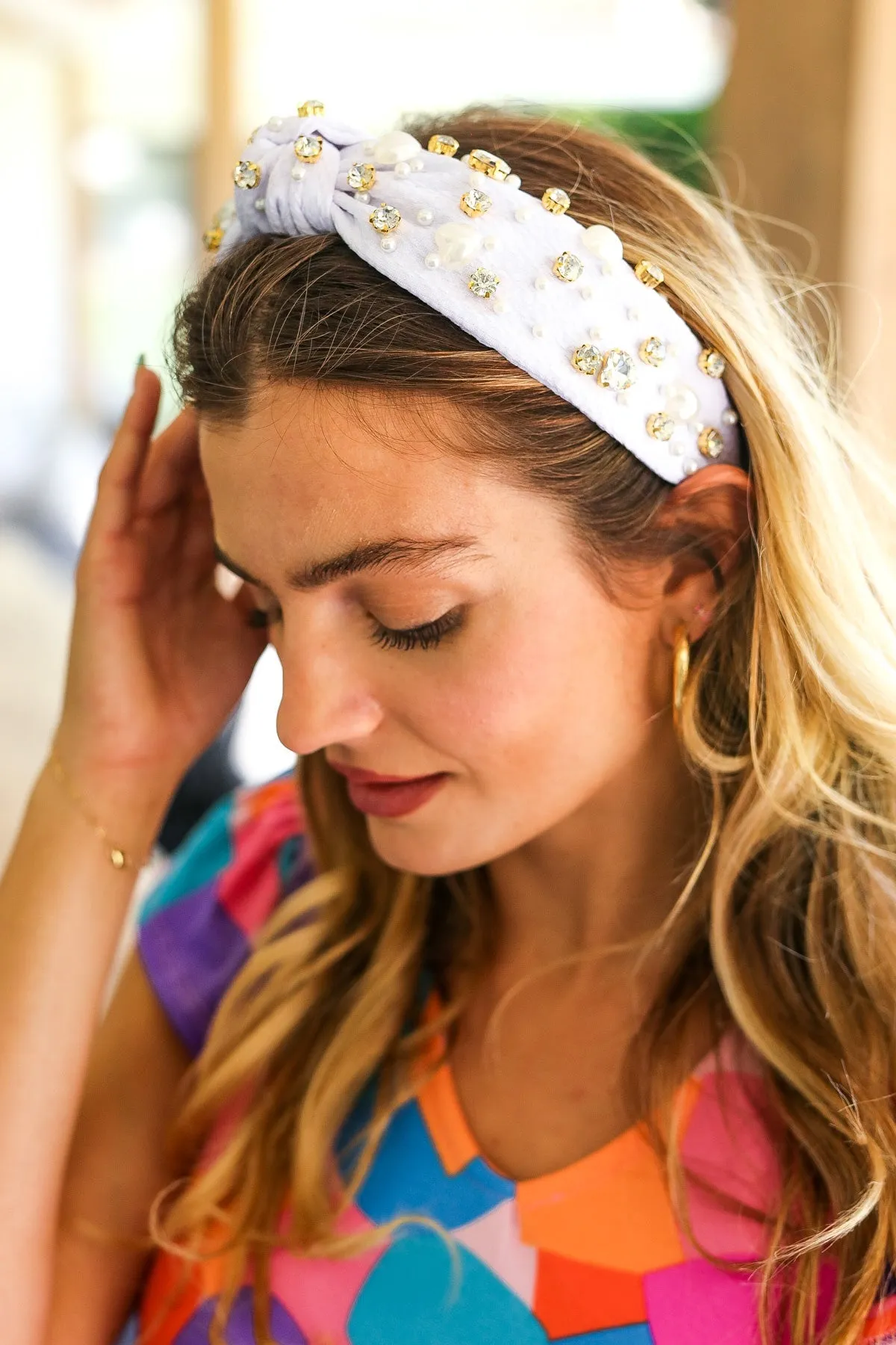 White Heart Pearl & Jewel Knot Knit Headband sold by Charming Charlie