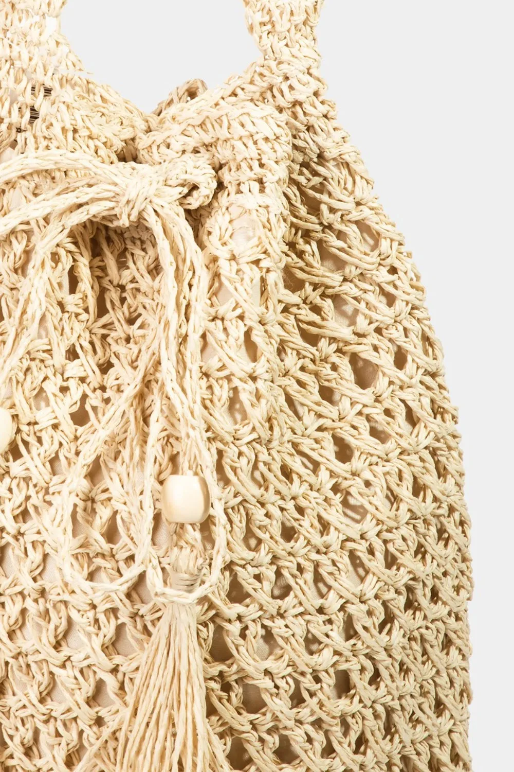 Fame Straw Braided Drawstring Tote Bag with Tassel sold by Charming Charlie product image thumbnail 3