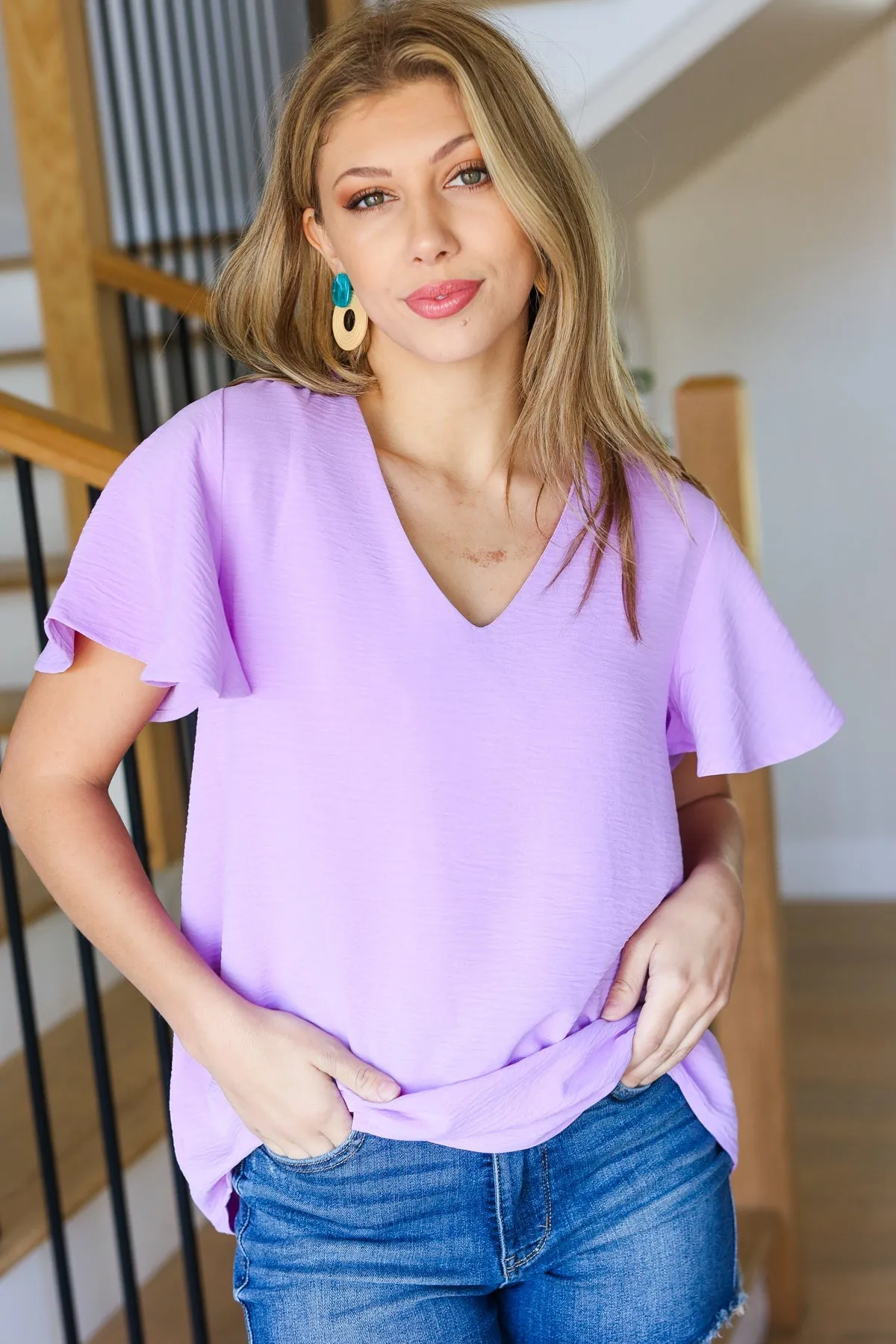 Keep Your Cool Lavender Flutter Sleeve V Neck Top sold by Charming Charlie