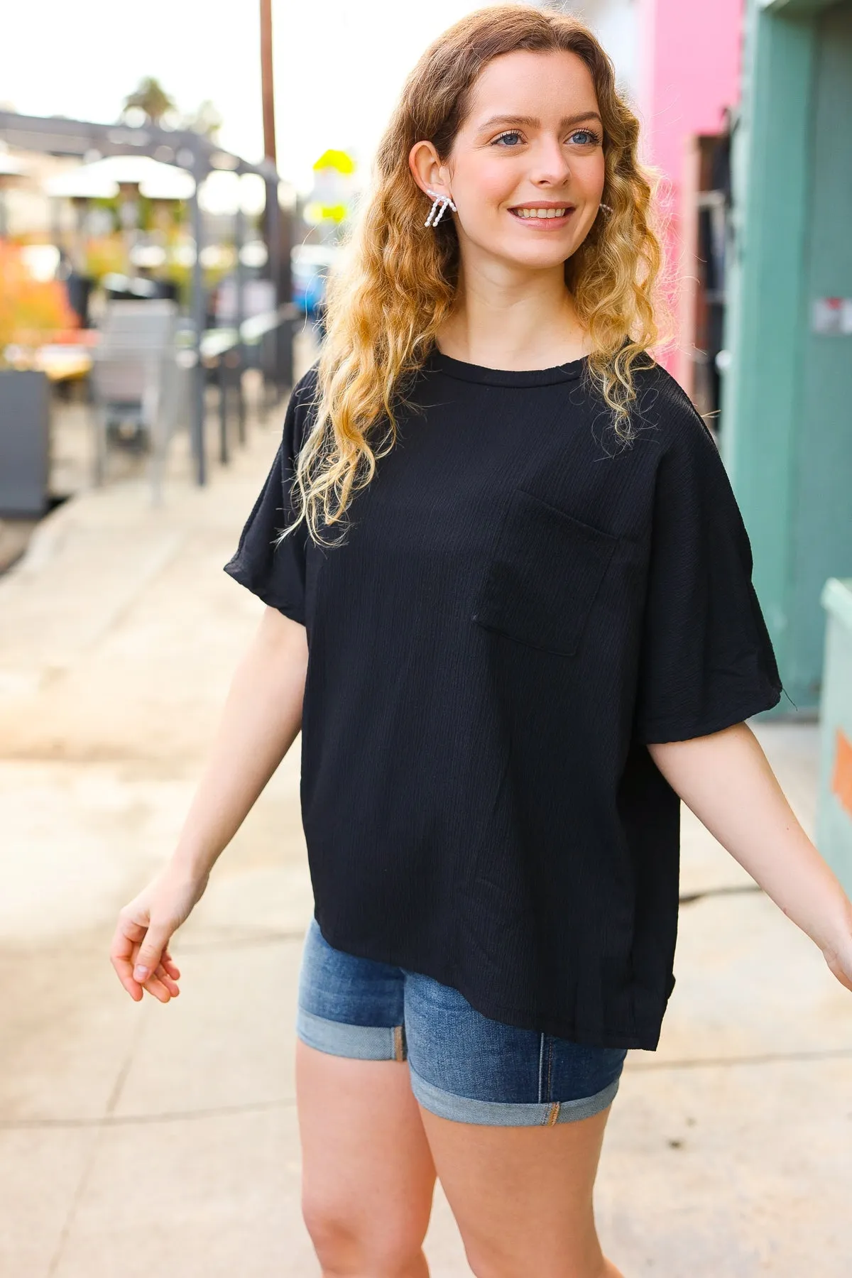 Be Bold Black Crinkle Texture Pocketed Dolman Top sold by Charming Charlie product image thumbnail 4