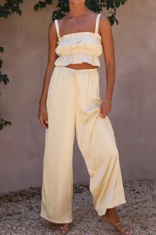Ruffled Sleeveless Top and Wide Leg Pants Set sold by Charming Charlie