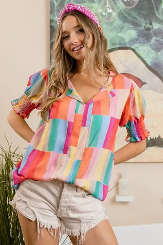 BiBi Color Block Smocked Short Sleeve Blouse sold by Charming Charlie