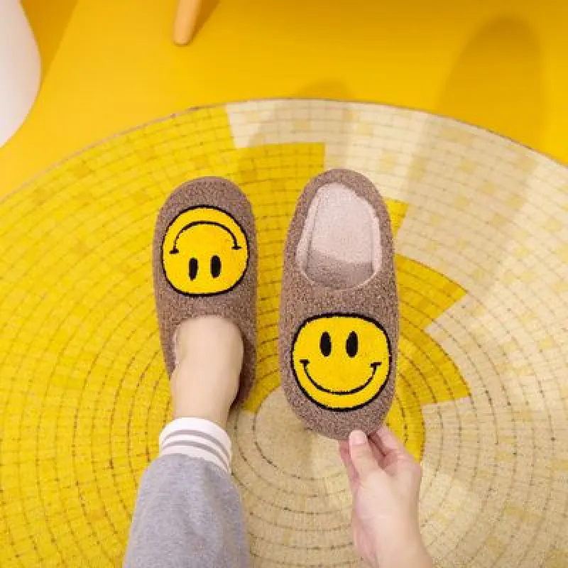 Melody Smiley Face Slippers sold by Charming Charlie