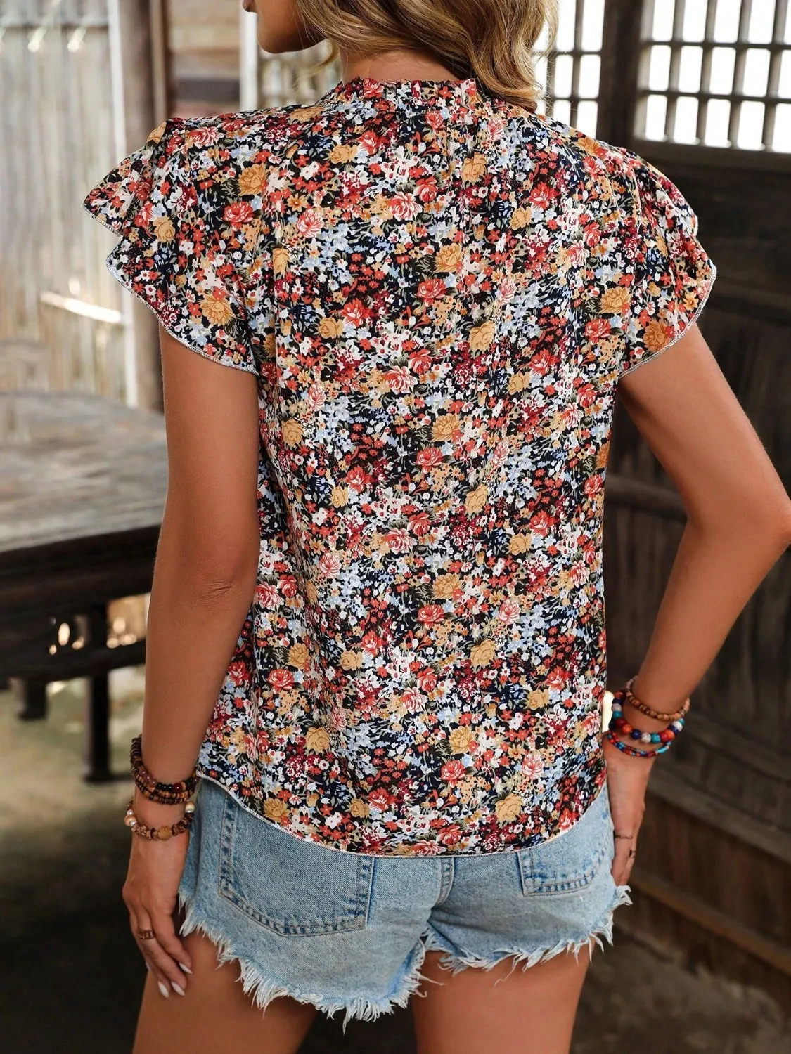 Floral Notched Cap Sleeve Blouse sold by Charming Charlie product image thumbnail 3
