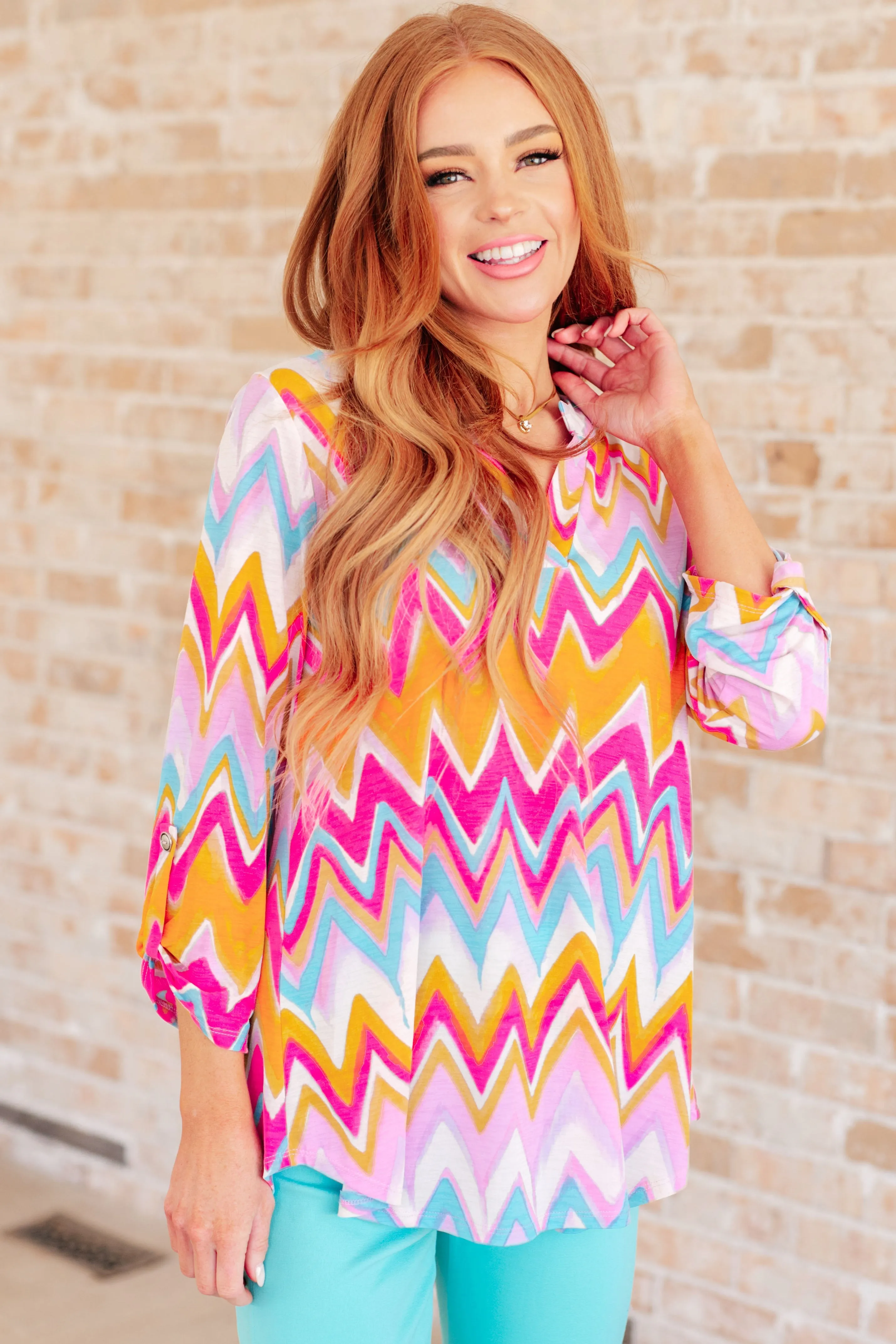 Lizzy Top in Orange Multi Chevron sold by Charming Charlie