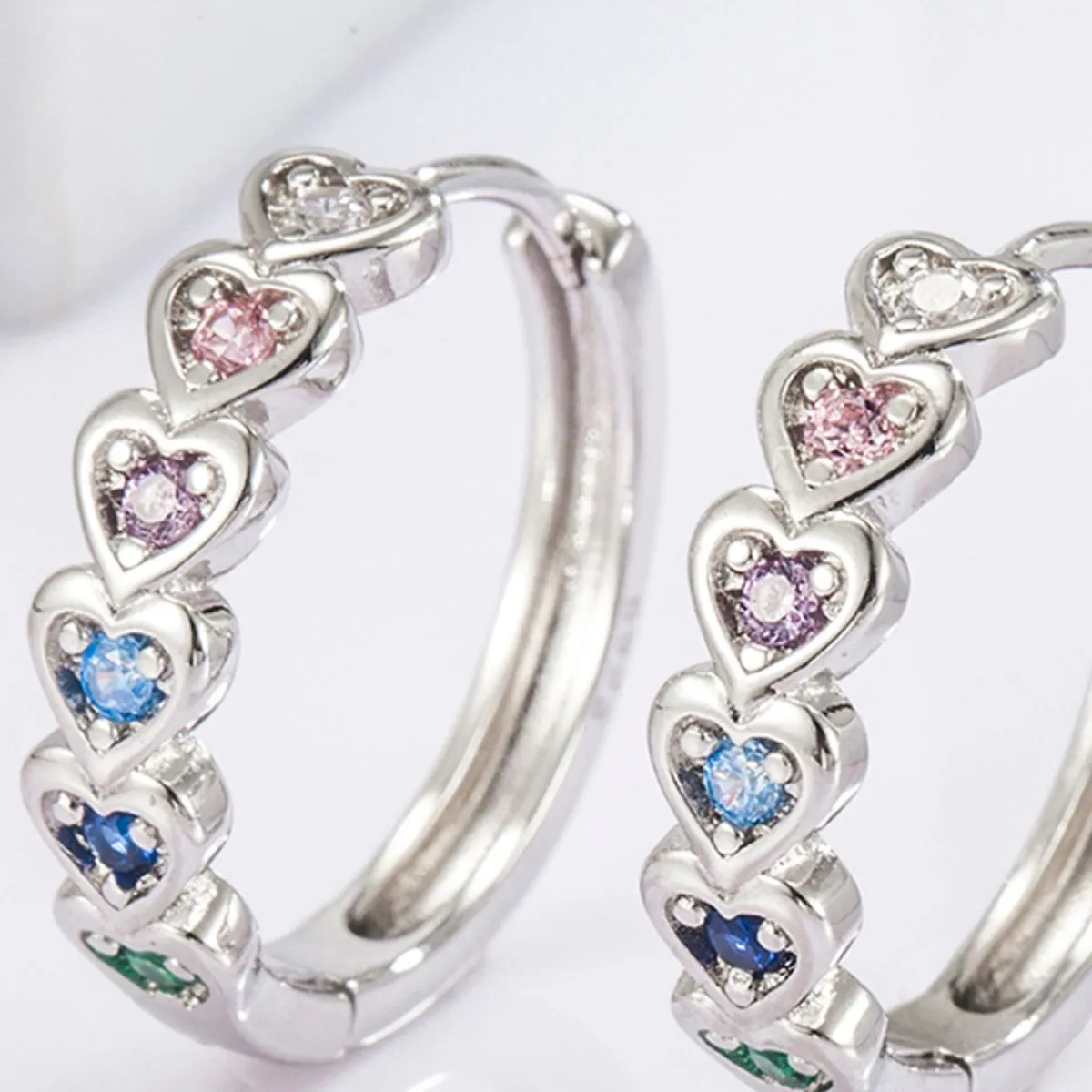 925 Sterling Silver Inlaid Zircon Heart Huggie Earrings sold by Charming Charlie product image thumbnail 4