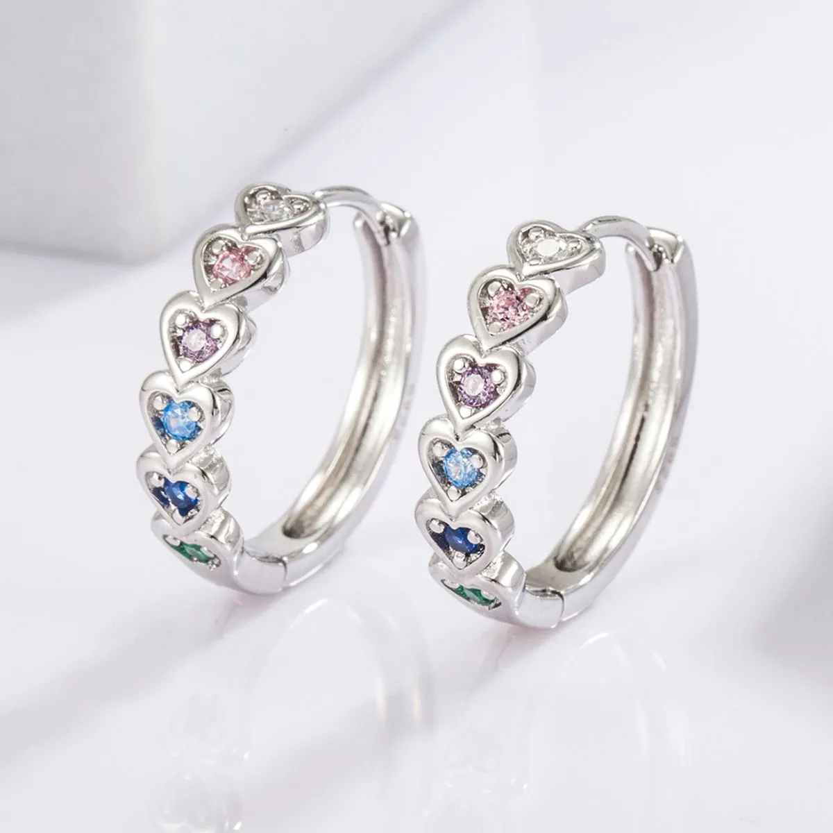 925 Sterling Silver Inlaid Zircon Heart Huggie Earrings sold by Charming Charlie